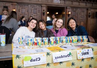 Four students advertising outdoor club